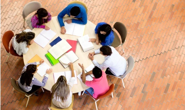 Students sitting round a table